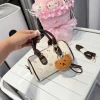 Túi xách HelloKitty size 20 giảm 50% - Cầm tay Someris tặng charm xinh, giá chỉ 83788đ 10