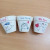 Chậu đất nung vẽ hình cute không phai không trôi màu, giá chỉ 7.500₫