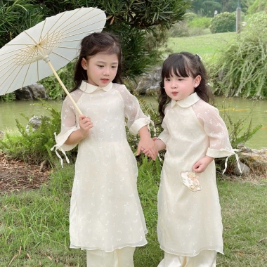 Áo dài bé Sora bébé Thiên An chất liệu tơ siêu nhẹ in nơ xinh đẹp dáng suông cổ sen tay lỡ 1-6 tuổi - Giá ưu đãi 305.000 VND