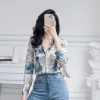 Áo sơ mi lụa nữ họa tiết tờ báo xanh vàng dài tay - Giá chỉ 185.000 VND