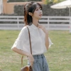 Áo sơ mi trắng dáng suông tay bèo tinh tế, thanh lịch cho nữ - Giá chỉ 169.000₫ 9