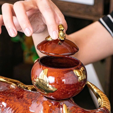 Bộ ấm chén trà Trâu Vàng xoay 360 độ độc đáo - thiết kế mộc mạc, gắn liền quê hương, giá ưu đãi 885.000₫