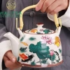 Bộ Ấm Trà Sứ 900ml Quai Xách Lưới Lọc Họa Tiết Sen Cá - Giá ưu đãi 429k 3