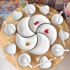 Bộ bát đĩa sứ decor hoa mặt trời: Sét đĩa mặt trăng 5 cánh trắng viền đen 42cm, giá 85.000₫