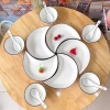 Bộ bát đĩa sứ decor hoa mặt trời: Sét đĩa mặt trăng 5 cánh trắng viền đen 42cm, giá 85.000₫ 4