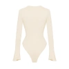 Body suit nữ khoét ngực dây đan, tay loe dài, thun gân ôm dáng, nút bấm màu kem Dionysus 360k 6