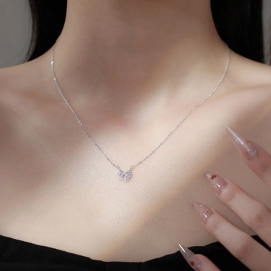 Dây chuyền bạc nữ 999 Calae nơ thắt đá hồng charm nhẹ nhàng - Giá 509.000đ