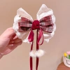 Kẹp tóc nơ lớn ren ngọc trai đỏ năm mới cho bé ruy băng tua rua mặt sau siêu cổ tích 3