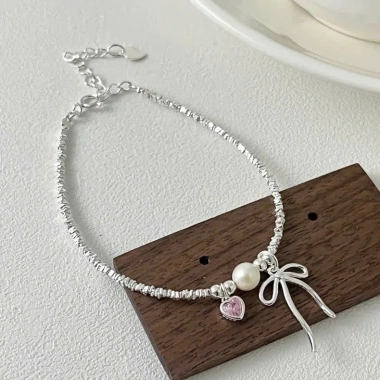 Lắc tay bạc nữ PMJ - Vòng tay hạt Charm nơ thắt, trái tim đá hồng cá tính PMJS372L giá ưu đãi 689.000₫ 7