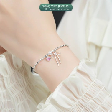 Lắc tay bạc nữ TLEE – Hạt bạc vỡ, charm nơ thắt, trái tim đá hồng, giảm 17%