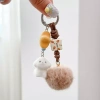 Móc khóa gấu nâu lông tơ fuzzy pom-pom - Đáng yêu, sang trọng, ô tô, giảm giá 53.810 VND 6