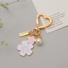 Móc khóa hoa anh đào OLVIDO, dây chuyền cườm ngọc trai mặt chữ - phụ kiện túi tai nghe sang trọng, giá ưu đãi 42.120₫ 10