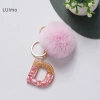 Móc khóa Luimo hồng pompom lông tơ 26 chữ cái, túi xách, quà tặng SBS 25.095₫ 9