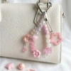 Móc khóa pastel hồng cho túi xách – Charm hoa tim ngôi sao, giá ưu đãi 35.000đ