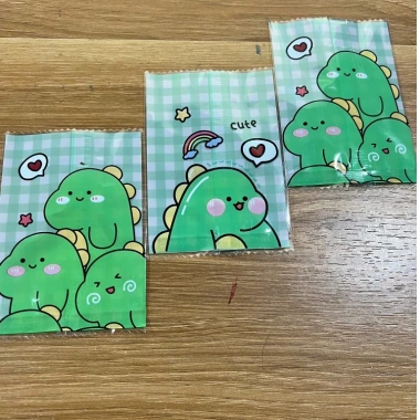 Set 100 túi nilon KHỦNG LONG, bao bì đựng bánh kẹo, trà hoa - Giá 17.000đ