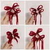 Set kẹp nơ nhung đỏ đính ngọc tiểu thư, 5 mẫu cho bé chơi Tết, giá 20.000đ