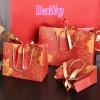 Túi giấy DANY Tết hoa mai có nơ, ruy băng sang trọng, chất liệu dày dặn - chỉ 20.000 VND