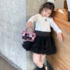 Túi xách mini bé gái dáng hộp da bóng kèm charm gấu, túi đeo chéo Tết 85k 4