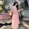 Áo dài cách tân nữ 4 tà vải tơ thêu cổ tròn nơ hoa, kèm quần lụa và bờm Lumi Studio AD05 - Giá 265.200₫