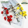 Cành đào trang trí Tết 2.026 LIVILUXE – Giỏ quà tháp bánh kẹo, giảm giá 25.000đ