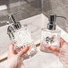 Chai chiết dầu gội sữa tắm + bình đựng nước rửa tay vân kim cương, chỉ 69.000đ 2