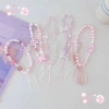 Dây Đeo Điện Thoại Hồng Cô Gái Đính Hạt Trái Tim Nơ Ngọt Ngào - Giá chỉ 5.900₫