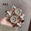 Đồng hồ đeo tay nữ thiết kế dệt dân tộc cổ điển, thạch anh đính cườm dễ thương – chỉ 55.330₫ 6