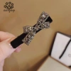 Kẹp tóc nhung đen đính đá viền nơ sang trọng và kiểu tiểu thư, giá chỉ 8.510đ 10