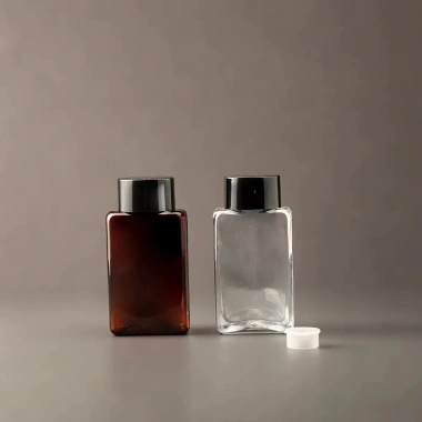 Lọ chiết chai nhựa dẹt trong nâu 100ml - Nắp nhựa đa dạng, giá chỉ 7.000đ