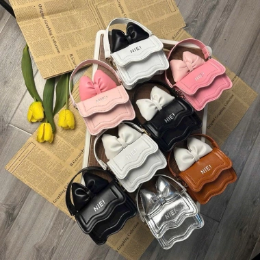 Túi mini đeo chéo in chữ NIE, nơ cute, phù hợp mẹ & bé - Giá 75.000 VND