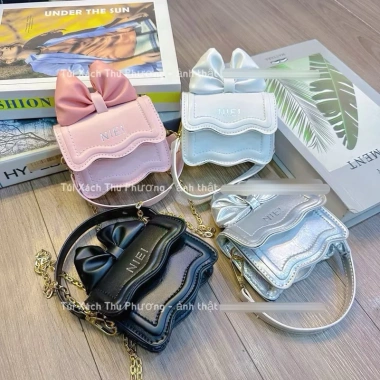 Túi mini đeo chéo in chữ NIE, nơ cute, phù hợp mẹ & bé - Giá 75.000 VND