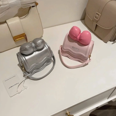 Túi mini đeo chéo nơ bạc in chữ NIE cute Hàn Quốc cho mẹ và bé - 75.000 VND 5