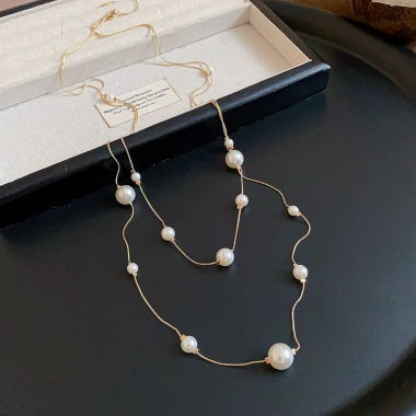 Vòng cổ nữ không đối xứng 2 lớp ngọc trai đính hạt, mặt dây thả - Giá 54.900₫