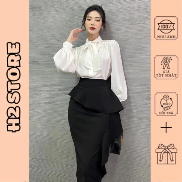 Vạt bèo dài của váy midi công sở khiến ngày làm việc ngồi ghế trở nên bất ngờ bất tiện - Ảnh 1
