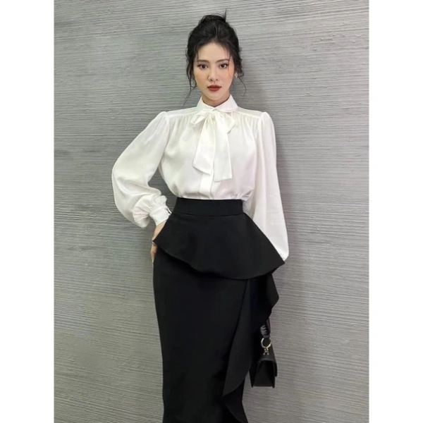 Nếu bạn đã sở hữu một chiếc váy có vạt bèo dài nhưng chưa muốn bỏ nó, có một số giải pháp thông minh để “rút gọn” và làm cho nó phù hợp hơn với môi trường văn phòng. (Ảnh 3)