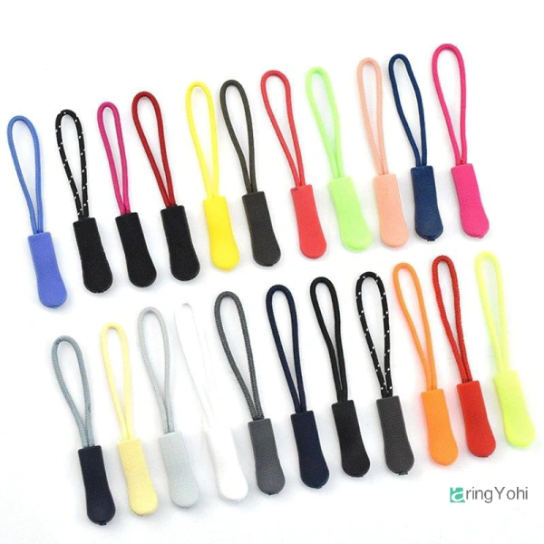Dây thẻ linh hoạt (còn gọi là “zip tab” hoặc “dây kéo phụ”) là một phụ kiện nhựa PVC dạng thanh dài, thường được gắn vào đầu dây kéo để tạo “tay cầm” dễ cầm. (Ảnh 2) Dây thẻ linh hoạt (còn gọi là “zip tab” hoặc “dây kéo phụ”) là một phụ kiện nhựa PVC dạng thanh dài, thường được gắn vào đầu dây kéo để tạo “tay cầm” dễ cầm. (Ảnh 2)